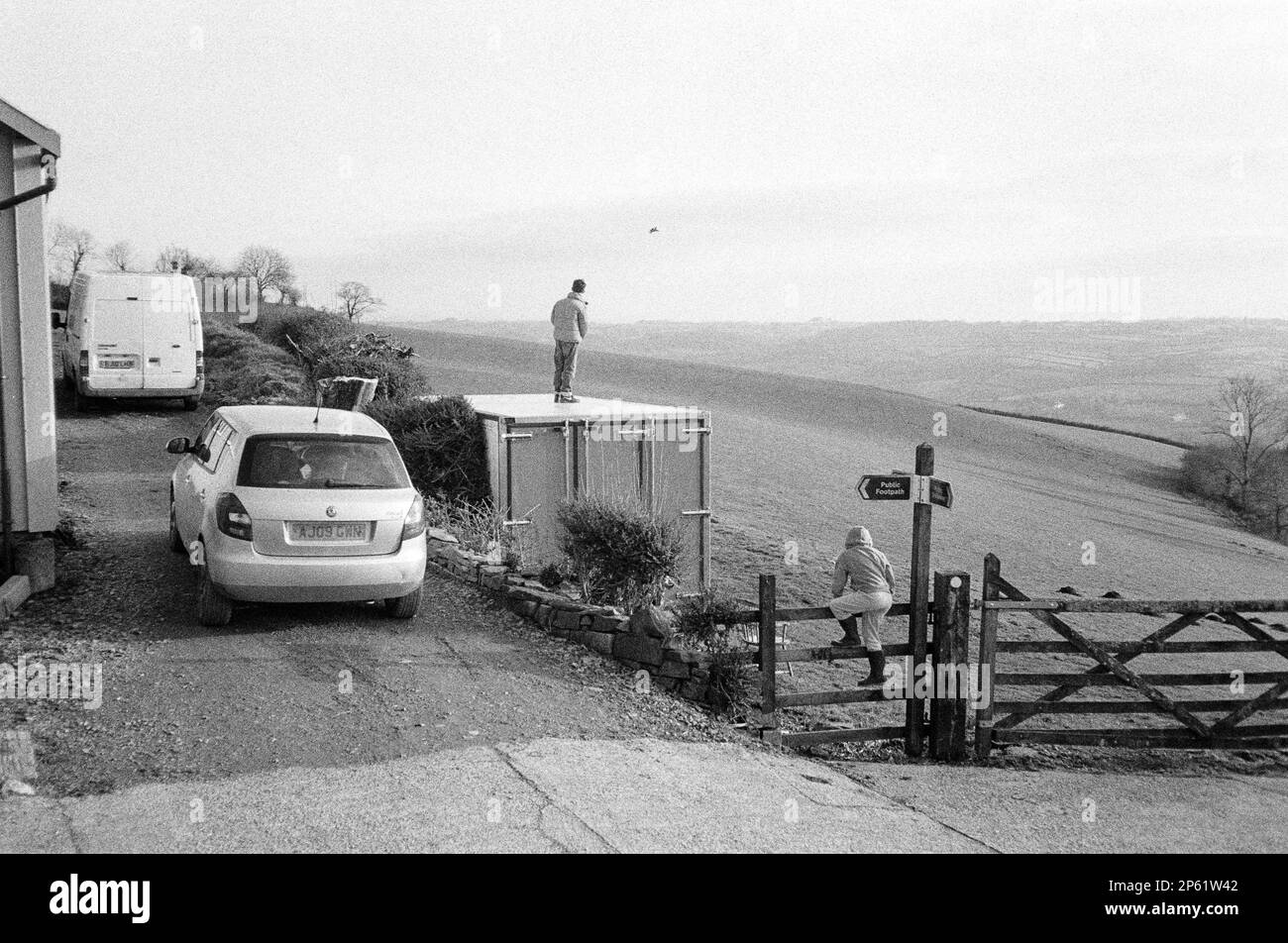 Thirteen year old boy flying a remote control aeroplane, High Bickington, North Devon, England, United Kingdom. Stock Photo