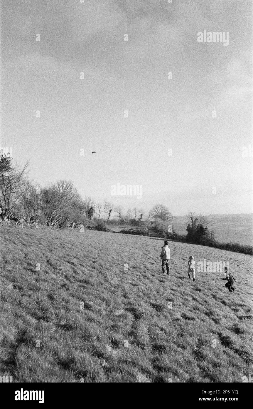Thirteen year old boy flying a remote control aeroplane, High Bickington, North Devon, England, United Kingdom. Stock Photo