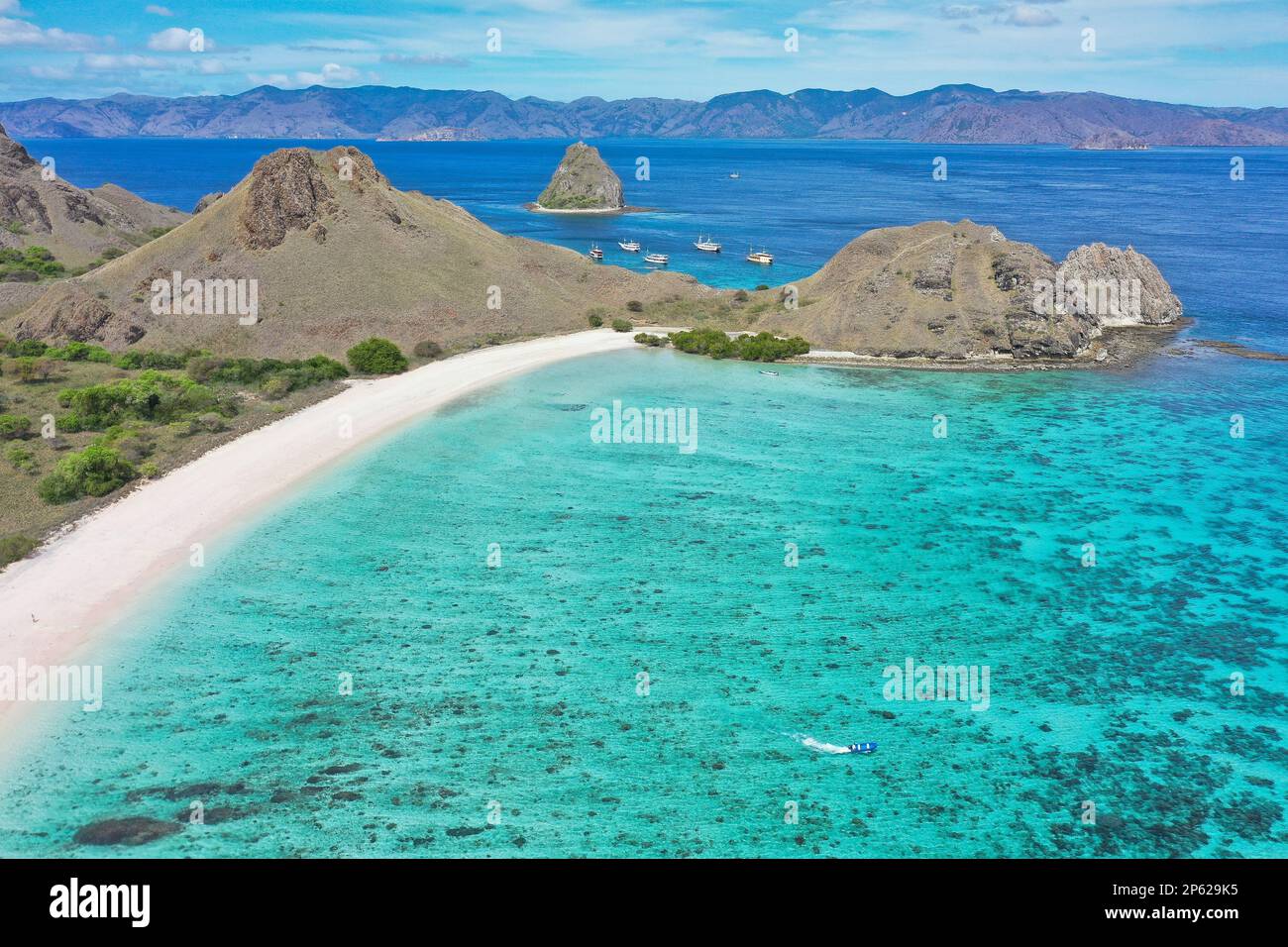 Komodo National Park on Flores with turquoise sea, Pink Beach and hills. Stock Photo