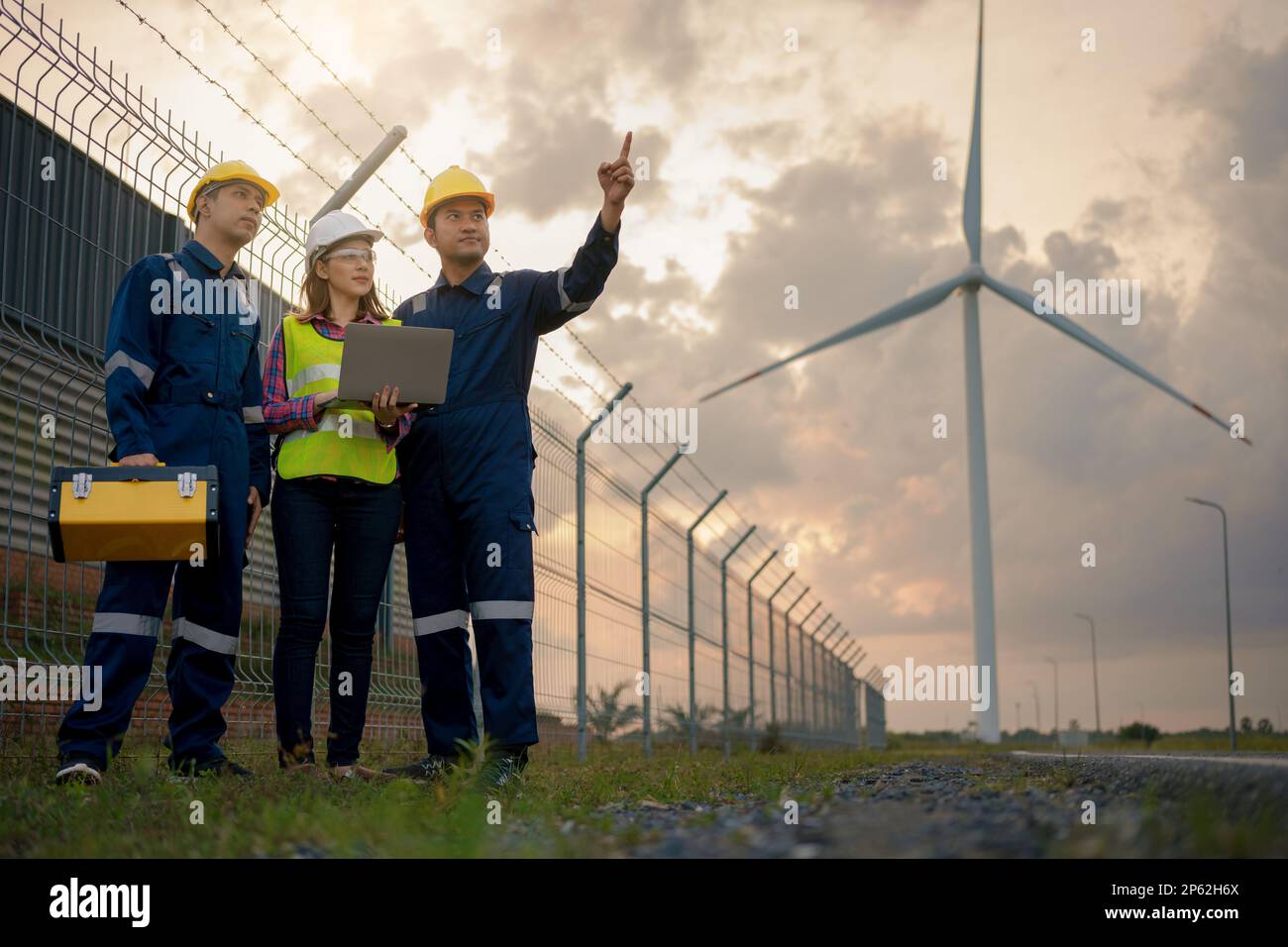 Three technician engineer in uniform with standing and checking wind