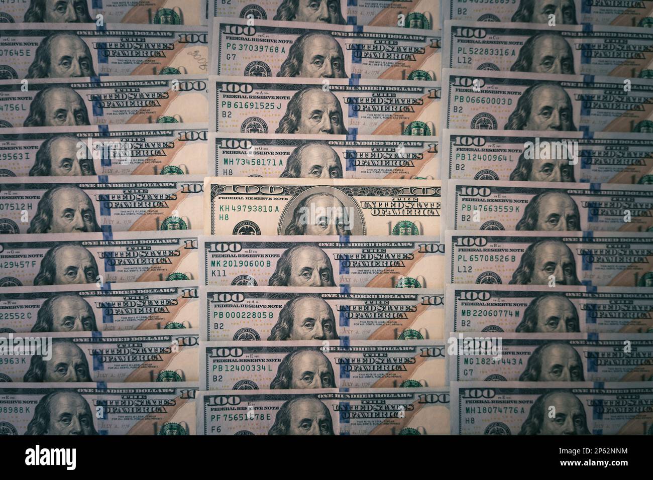 a lot of table bills on the background. One old bill among the new money. outdated design of a hundred-dollar bill Stock Photo