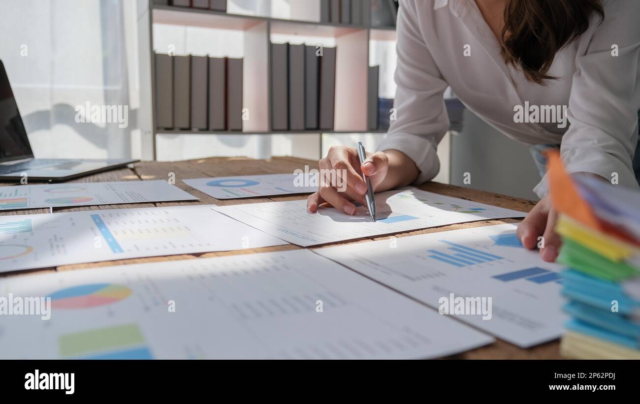Closeup businessperson analyzing graph and chart document report Stock ...