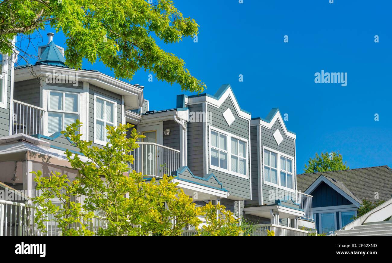 Top of residential building on blue sky background Stock Photo - Alamy