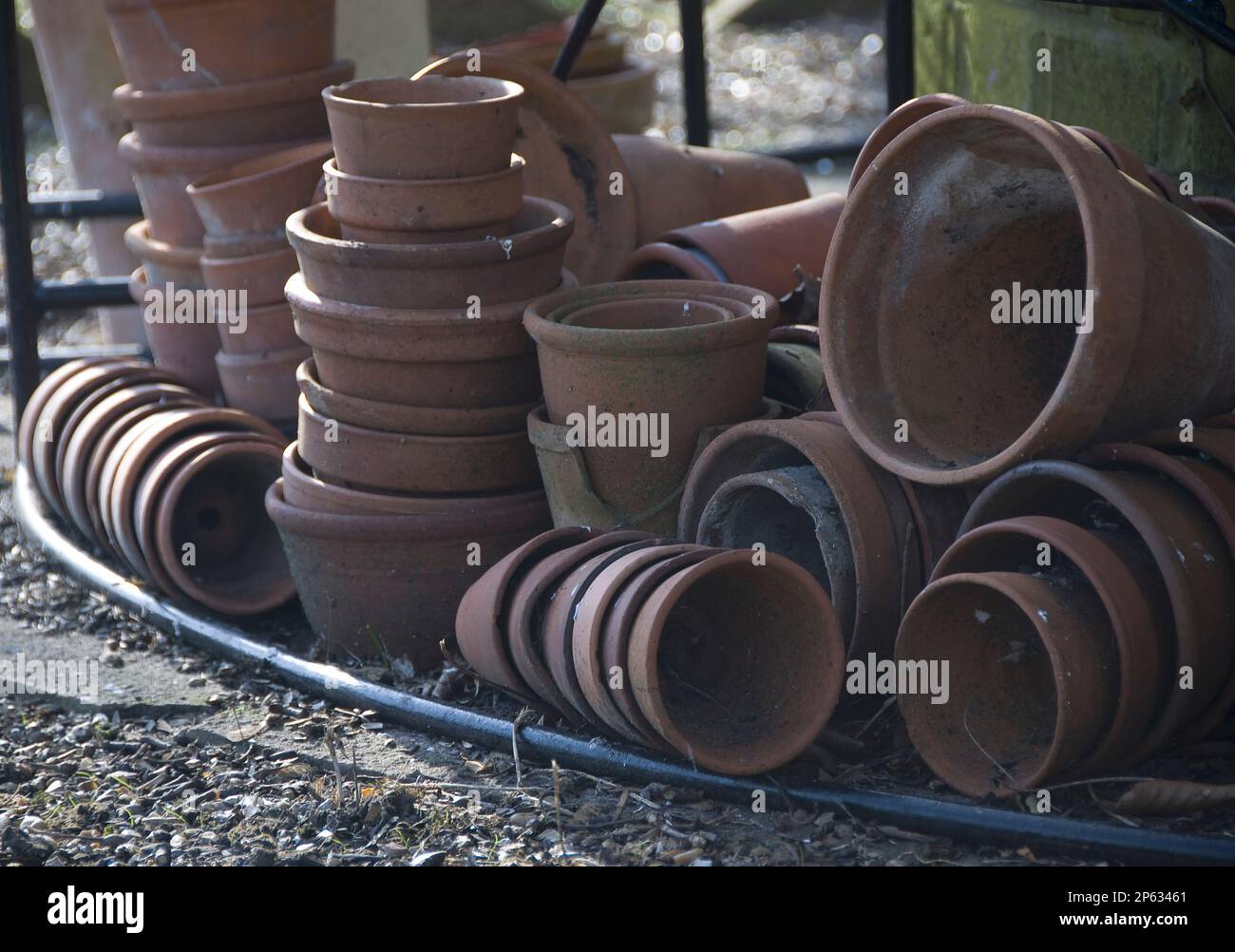 empty dirty terracotta garden pots in stacks Stock Photo - Alamy
