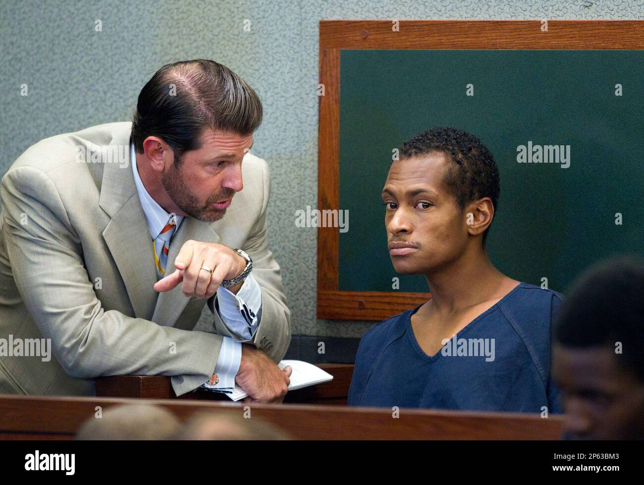 Noel Stevens listens to attorney Curtis Brown at the Clark County