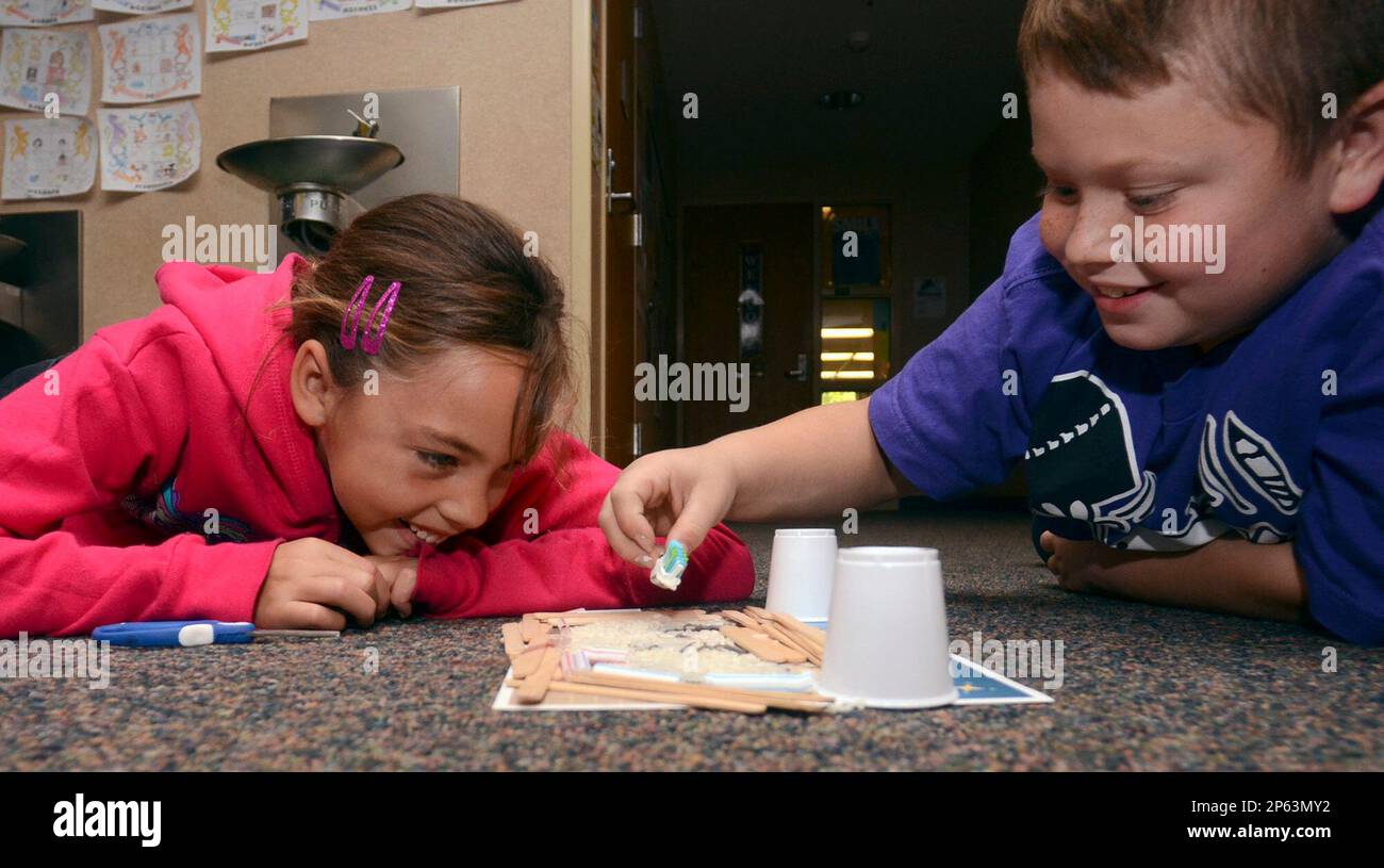 Farrington Grove Elementary fifthgrader Tristan Tarwater places the