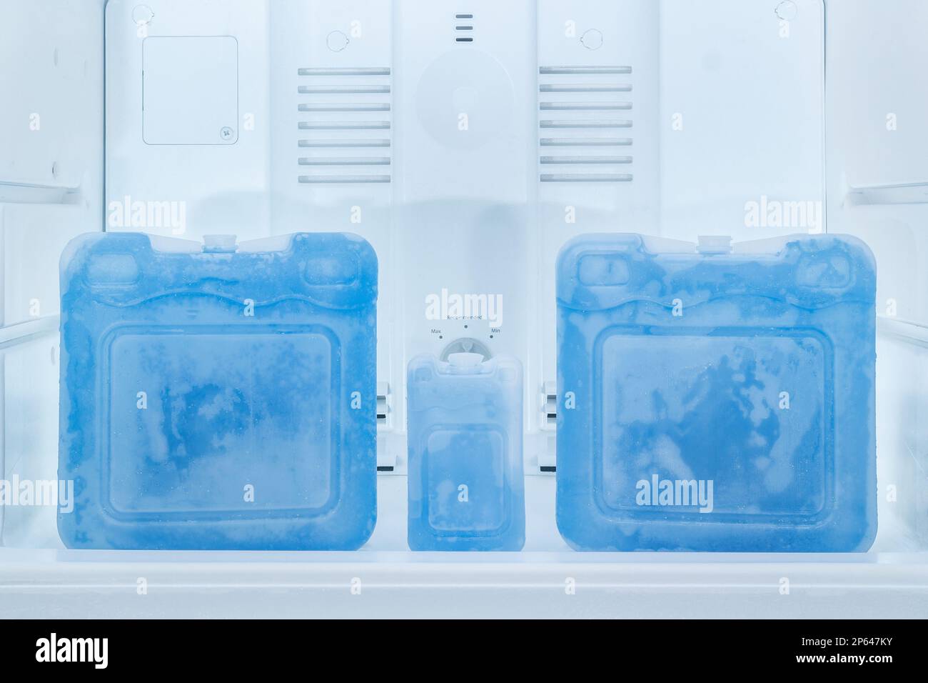 Blue ice packs in refrigerator freezer Stock Photo