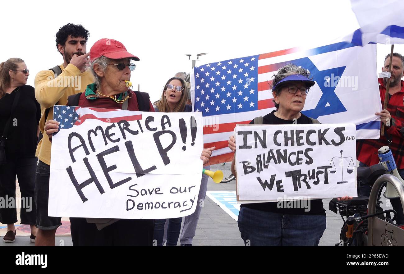 TEL AVIV, ISRAEL - MARCH 7: Protesters hold signs during a demonstration held by dual American-Israeli citizens calling for the US government to oppose Israel's judicial reform in front of the US embassy branch on March 7, 2023 in Tel Aviv, Israel. Credit: Eddie Gerald/Alamy Live News Stock Photo