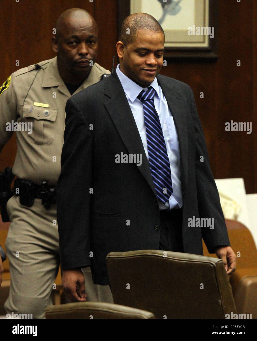 Kareem Lane walks into court Monday, Sept. 10, 2012 on the fifth day of