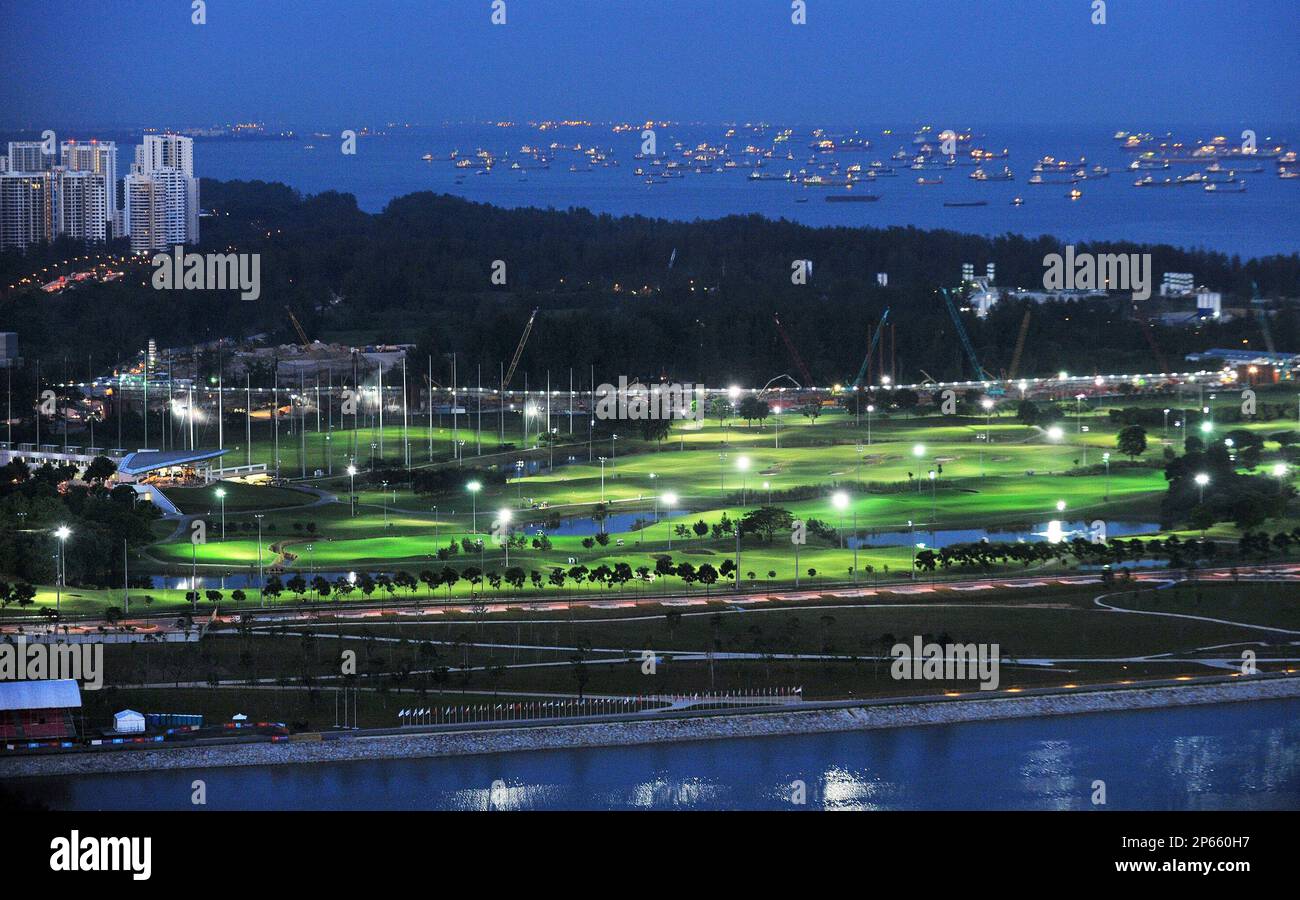 Image showcasing The Marina Bay Golf Course (centre) at dusk, showing the high-rise ...