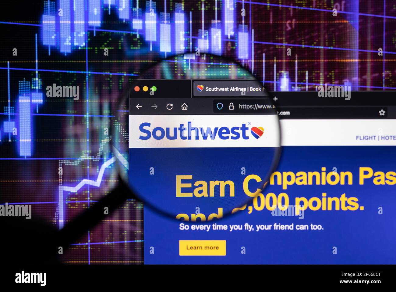 Southwest airline company logo on a website with blurry stock market developments in the background, seen on a computer screen Stock Photo