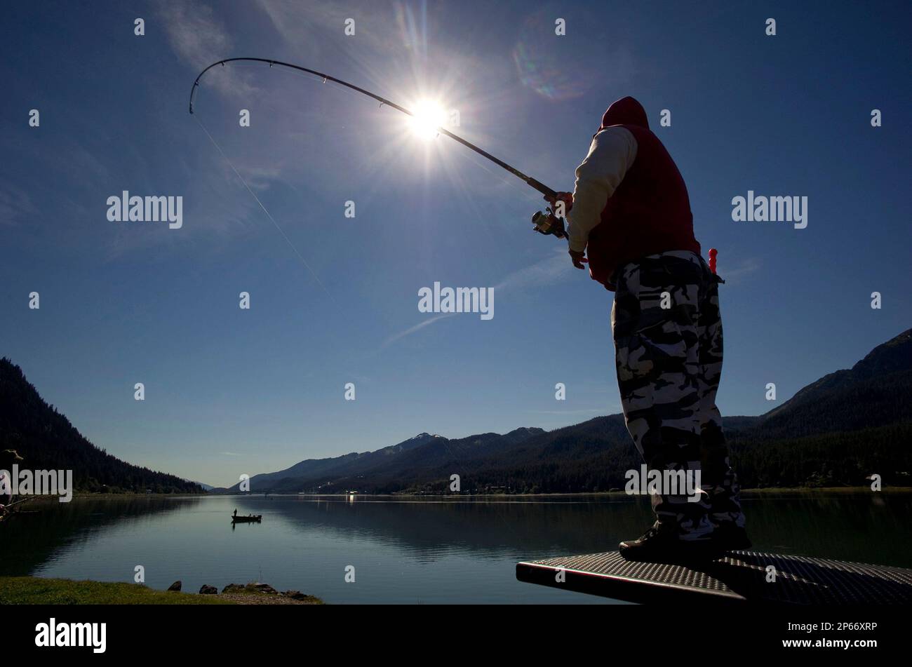 Tony Malacas fishes for silver salmon at the Wayside Park on