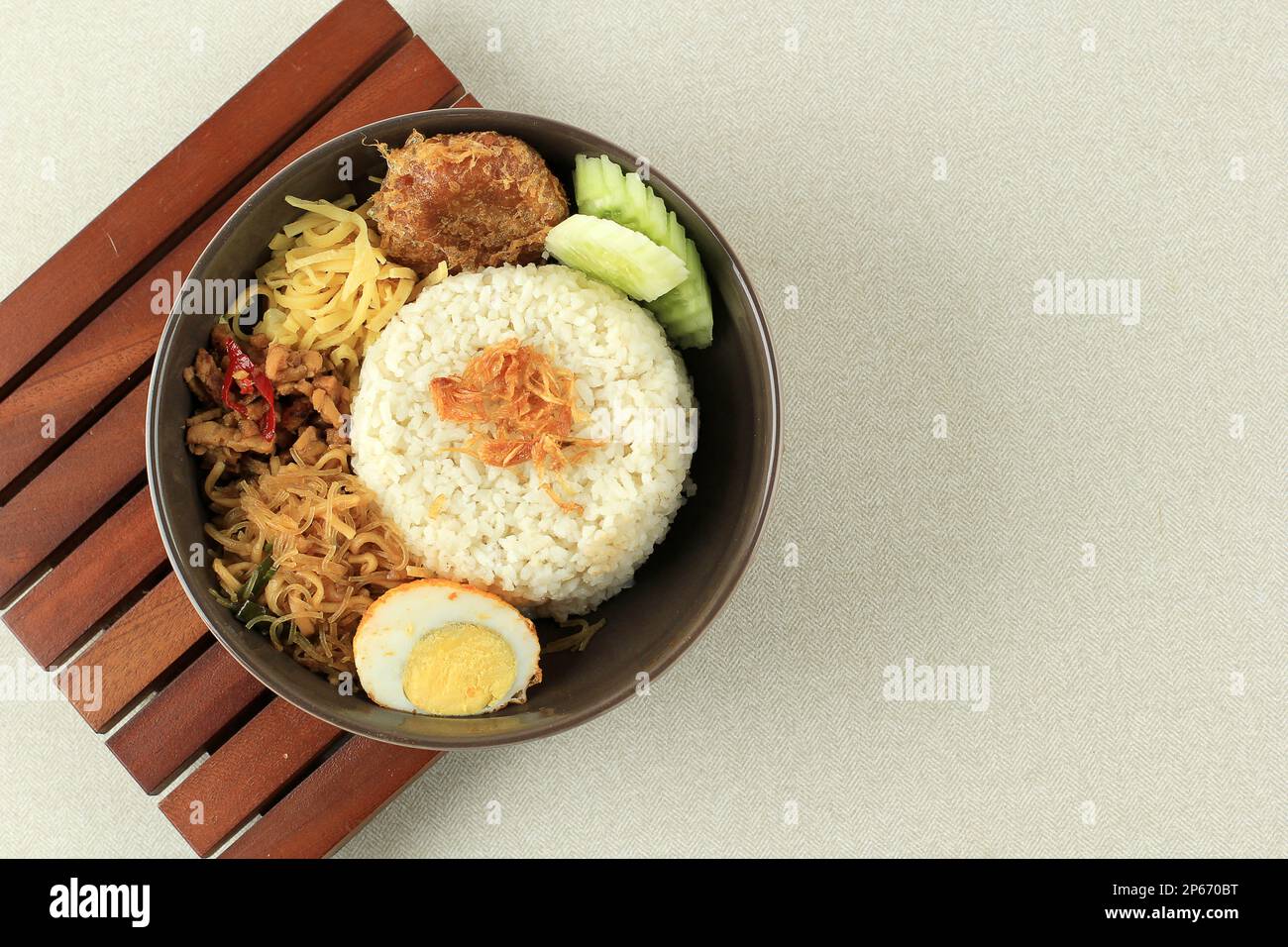 Nasi Uduk, Indonesian Savoury Steam Rice, Cooked in Coconut Milk. Served with Various Side Dish