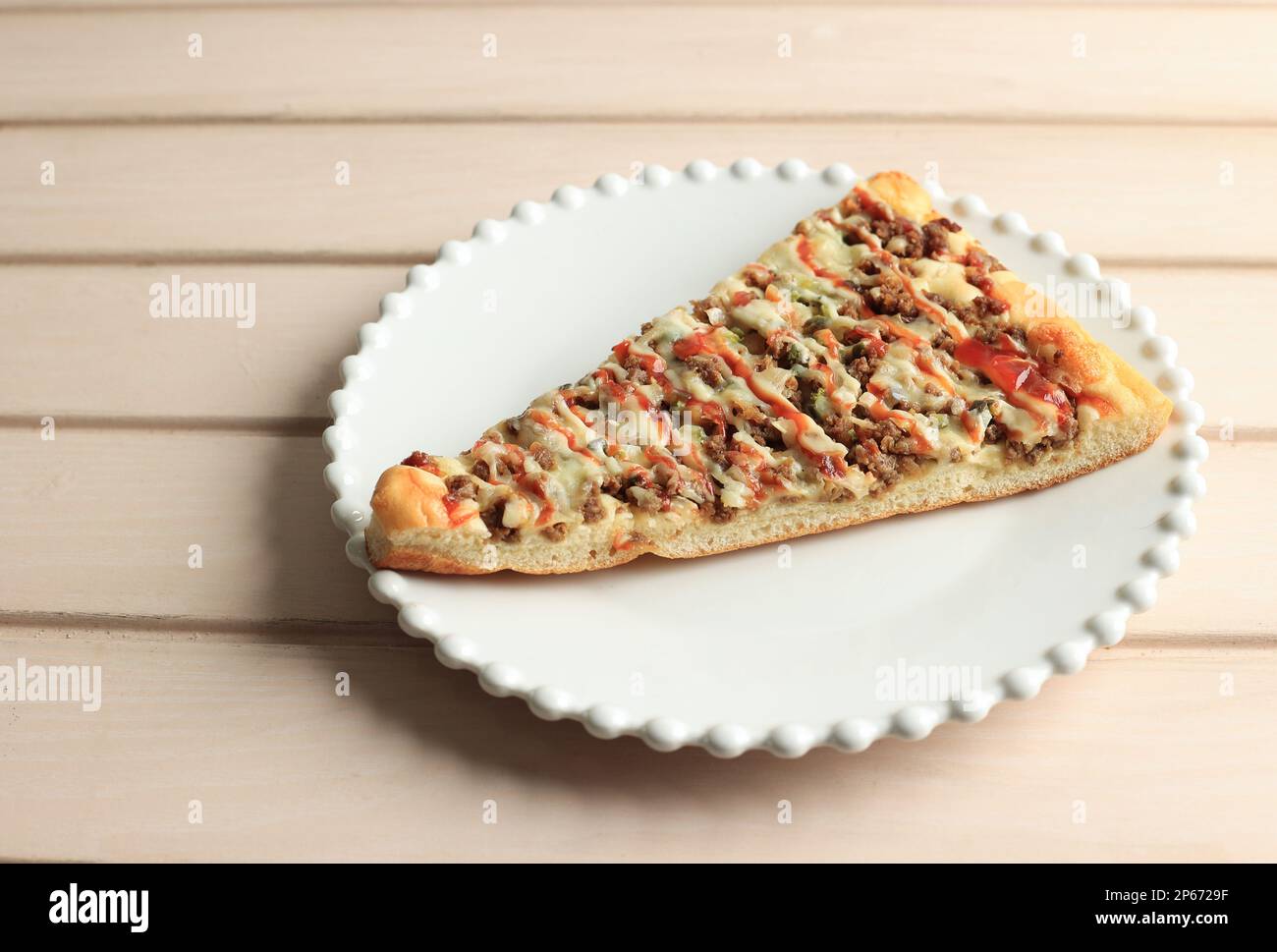 Big Slice Beef Pizza on White Plate Stock Photo Alamy