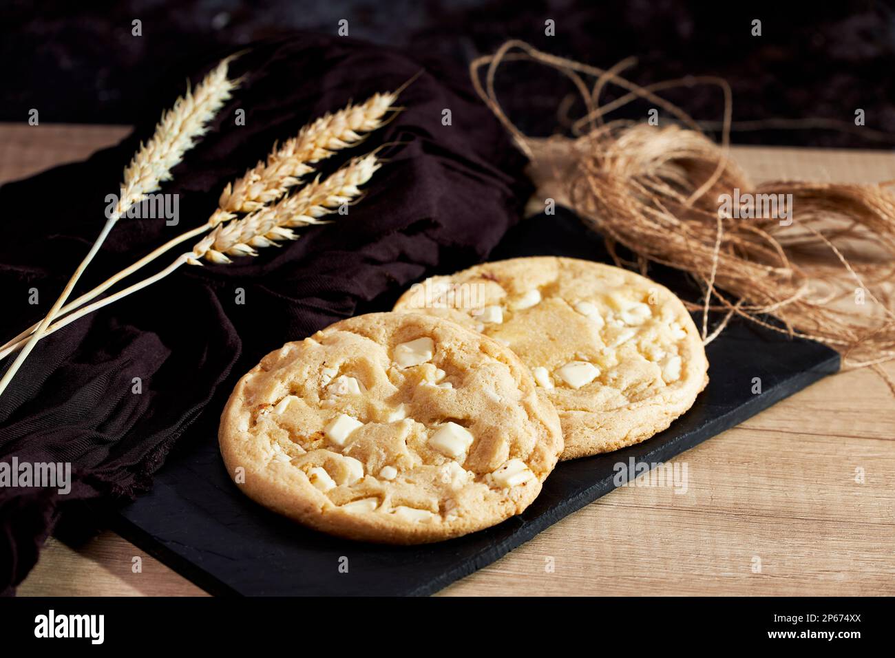 Freshly homemade chocolate cookies on a chalkboard. Sweet and tasty food Stock Photo