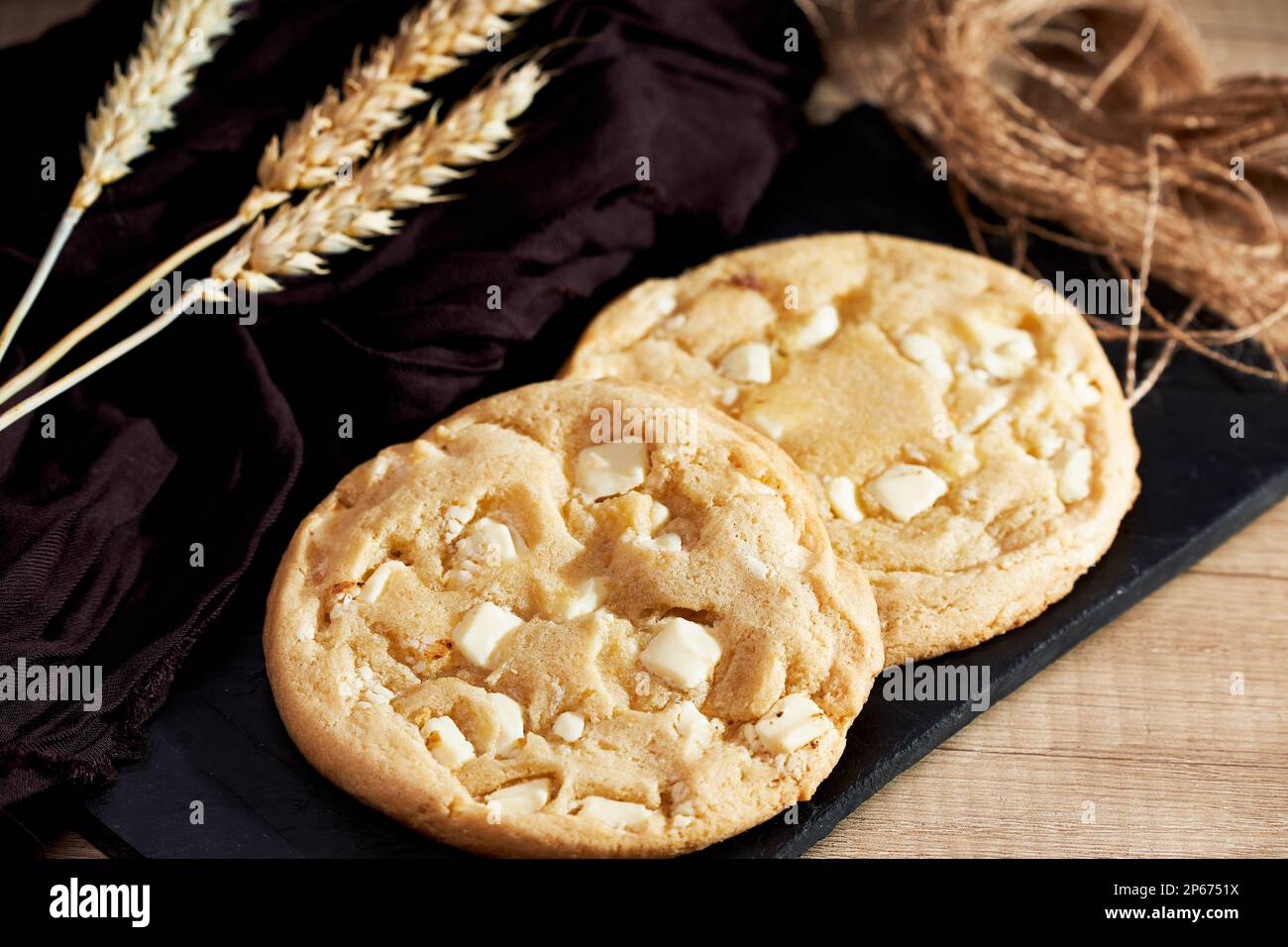 Freshly homemade chocolate cookies on a chalkboard. Sweet and tasty food Stock Photo