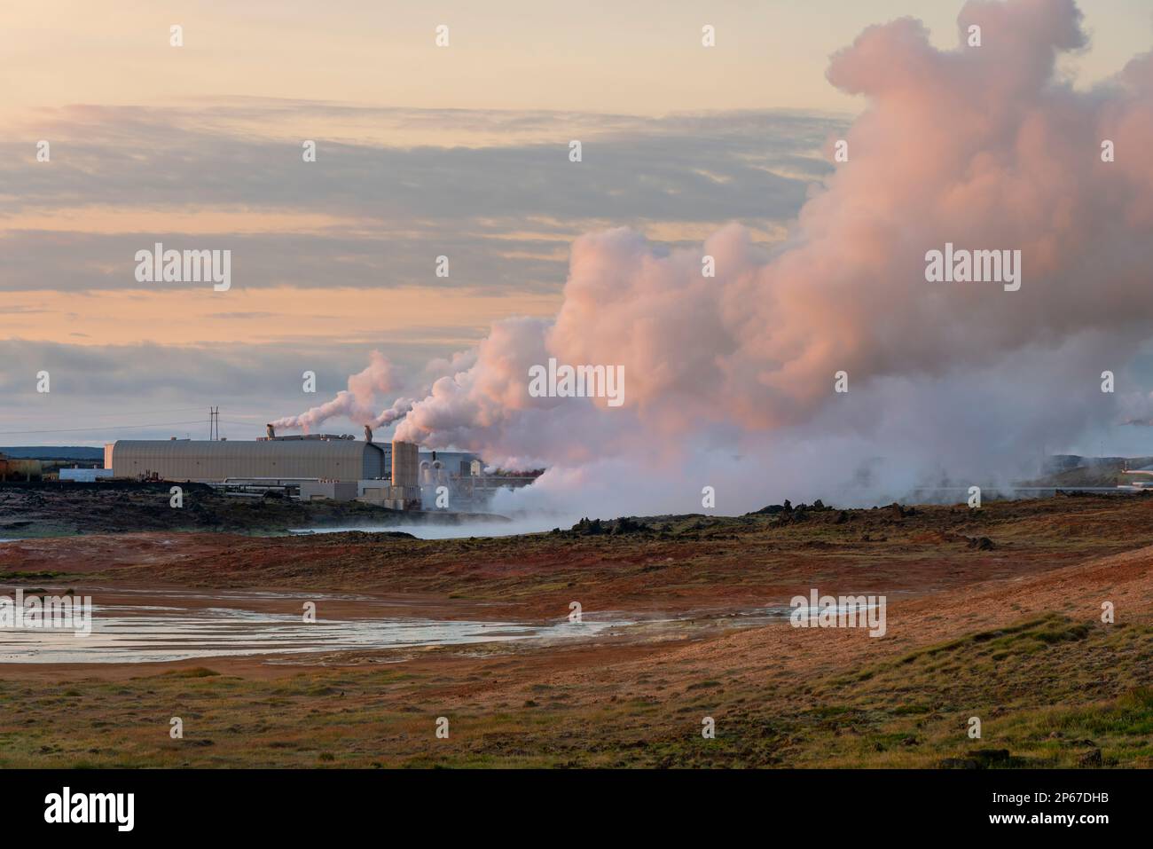 Geothermal Reykjanes power plant and smoking fumarole at Gunnuhver hot spring, Reykjanes Peninsula, Iceland, Polar Regions Stock Photo