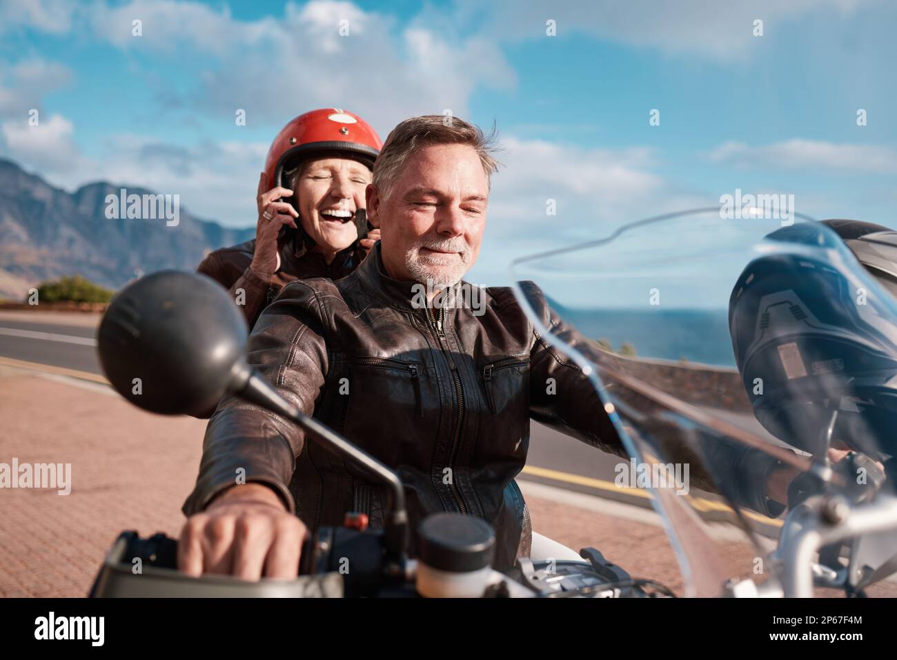 Travel, love and senior couple with motorbike, retirement and happiness for vacation, excited and cheerful. Freedom, old man and happy mature woman Stock Photo