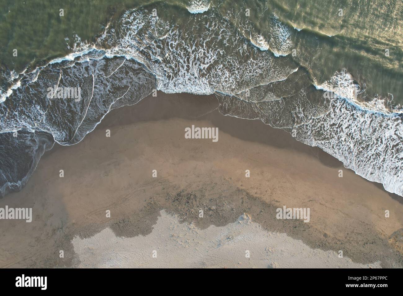 Empty beach on sunset time aerial above drone view Stock Photo