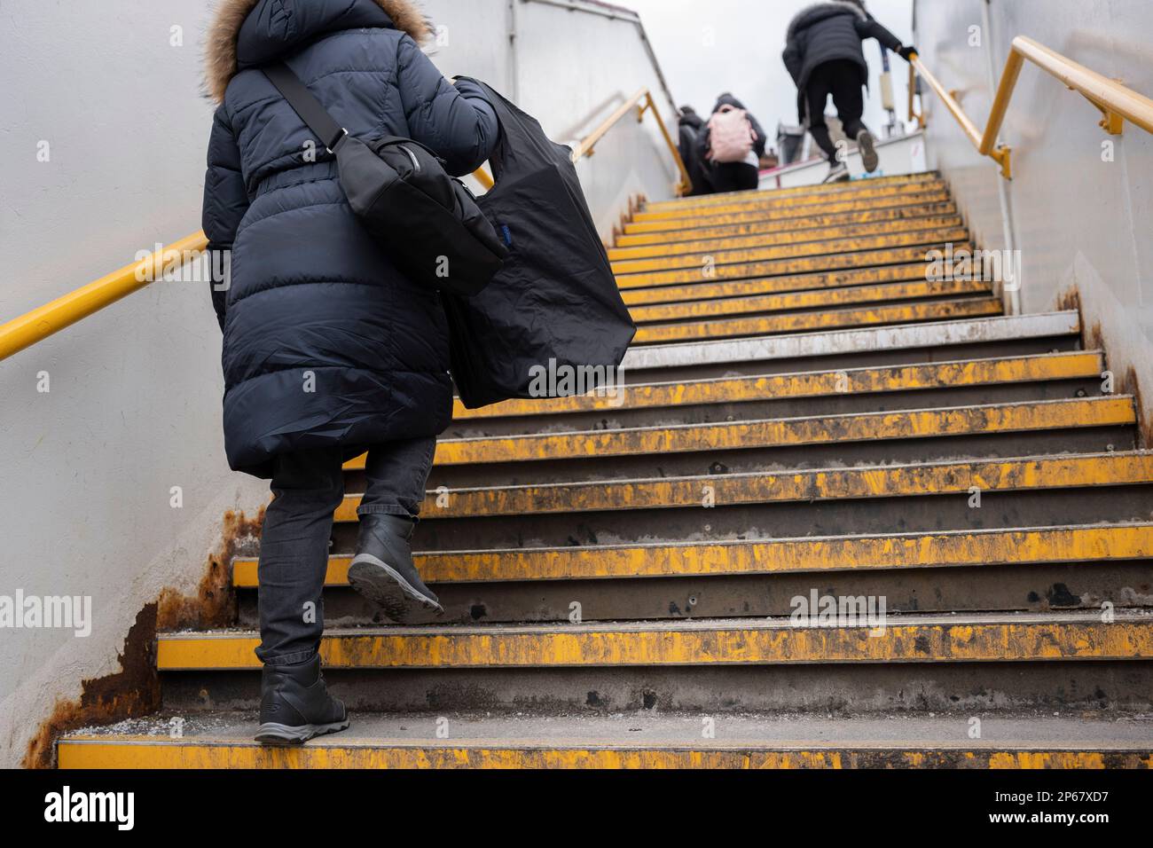 Rail passengers climb the steps at Kentish Town railway station in north London, on 6th March 2023, in London, England. Stock Photo