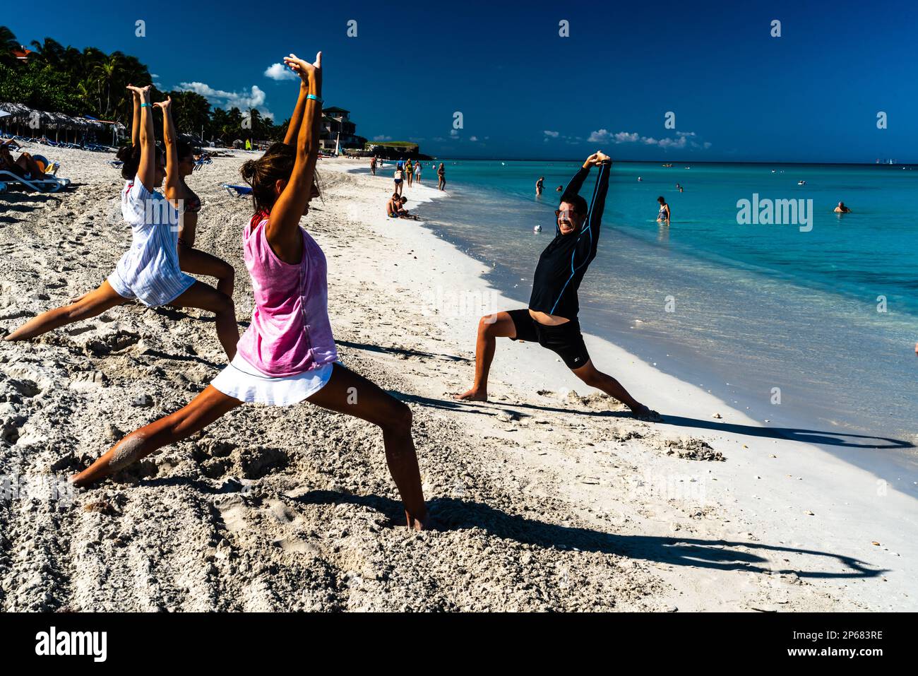 Enthusiastic stretching class to keep fit on the beach, Varadero, Cuba, West Indies, Caribbean, Central America Stock Photo