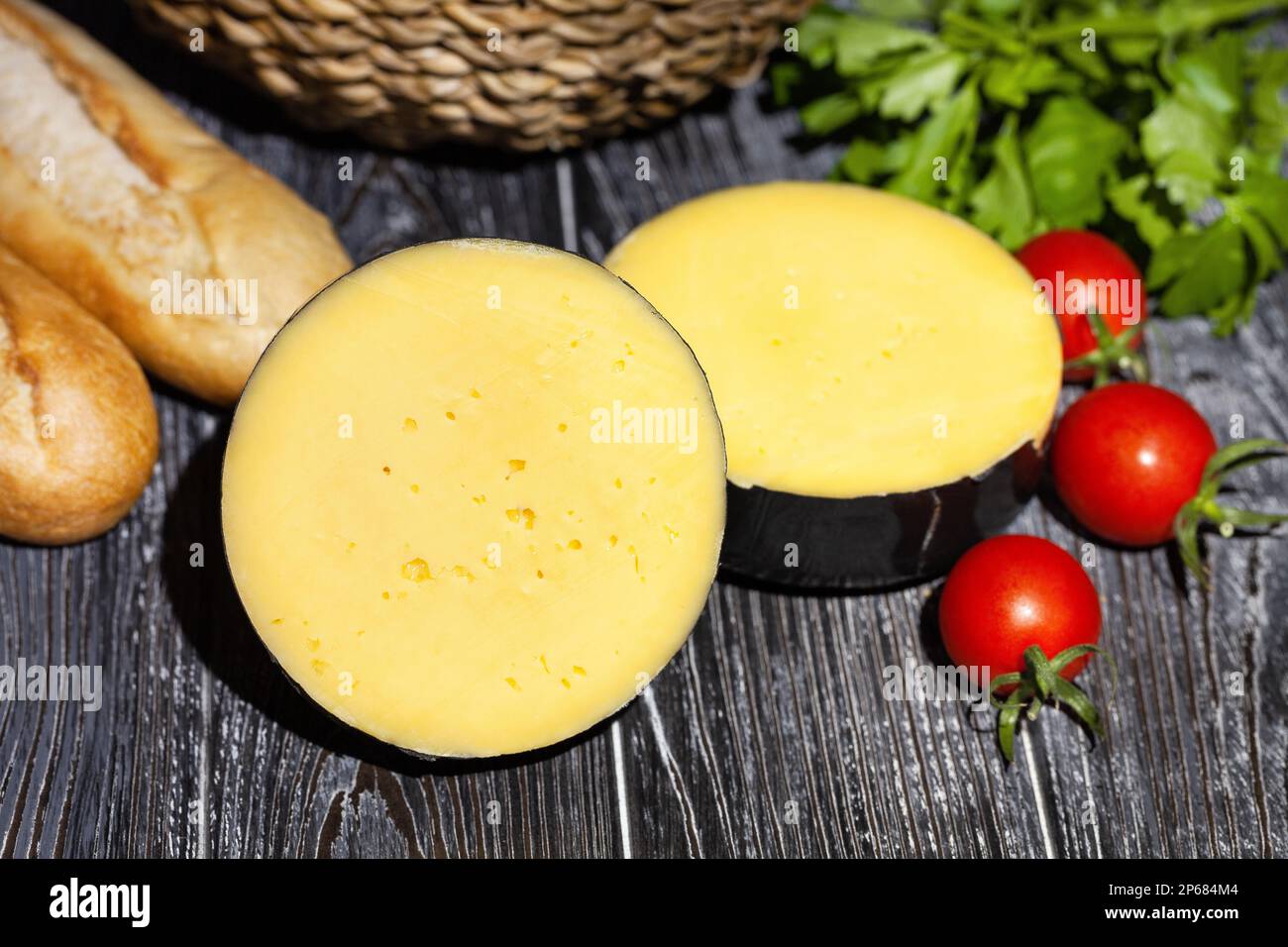 round cheese on wood background Stock Photo