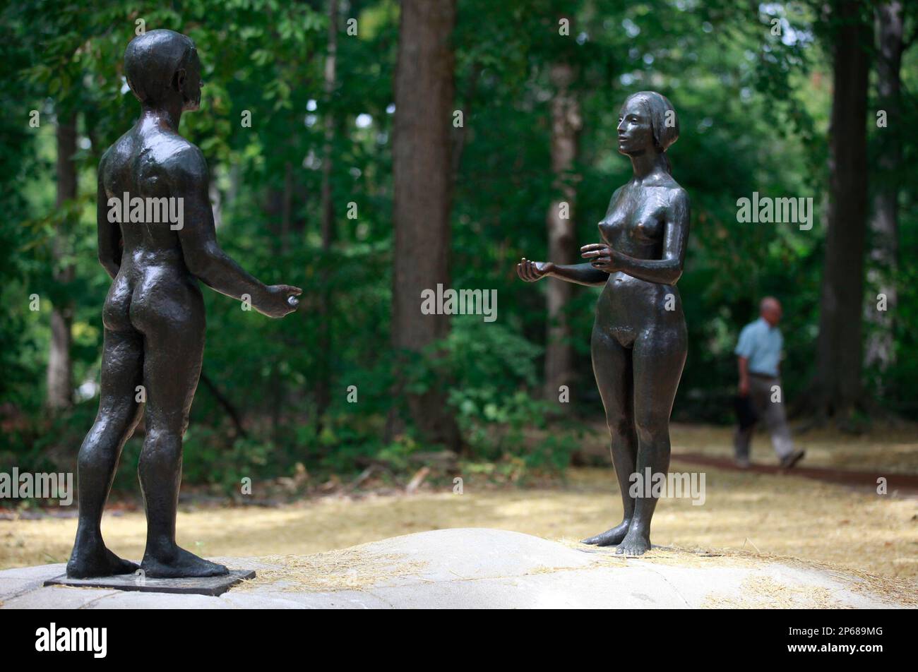 The Space Between Adam and Eve,” a sculpture by Jean Paul Darriau, is back in place on the east side of Dunns Woods on the Indiana University campus in Bloomington, Ind