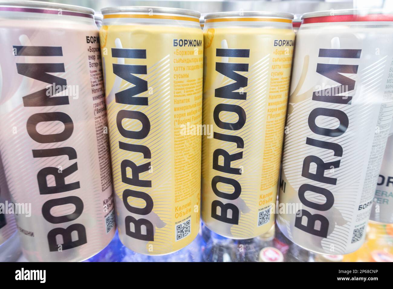 Borjomi mineral water in aluminum cans on the store counter Stock Photo