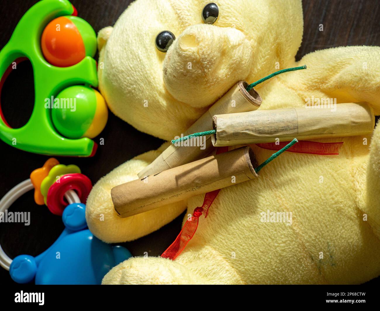 petards and firecrackers and toddler toys close up, conceptual photo of danger for kids Stock Photo