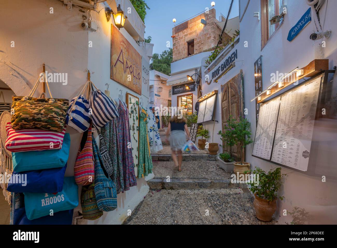 View of shops in Lindos street at dusk, Lindos, Rhodes, Dodecanese