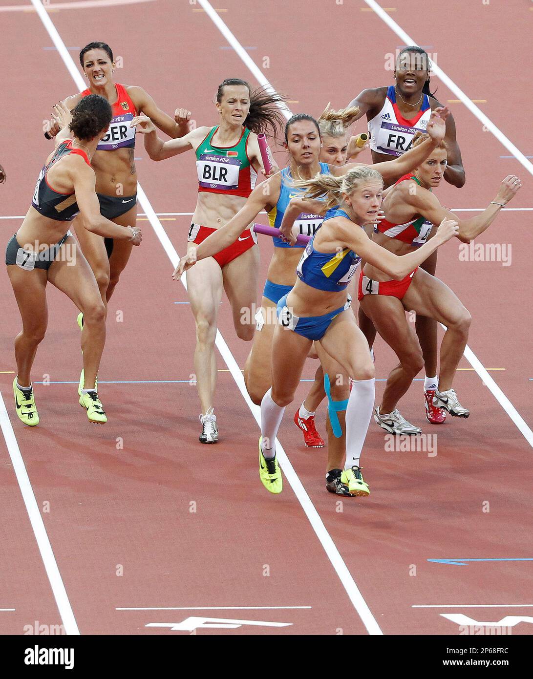 Teams in the Women's 4x400 relay exchange batons at the London Olympics