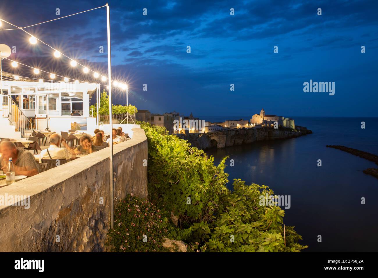 Restaurant in the old town on the promontory in the evening, Vieste, Gargano peninsula, Foggia province, Puglia, Italy, Europe Stock Photo