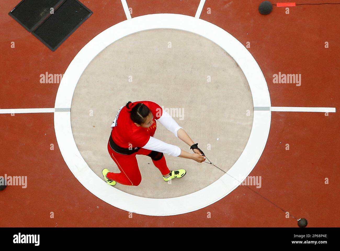 China's Zhang Wenxiu competes in the women's hammer throw qualification