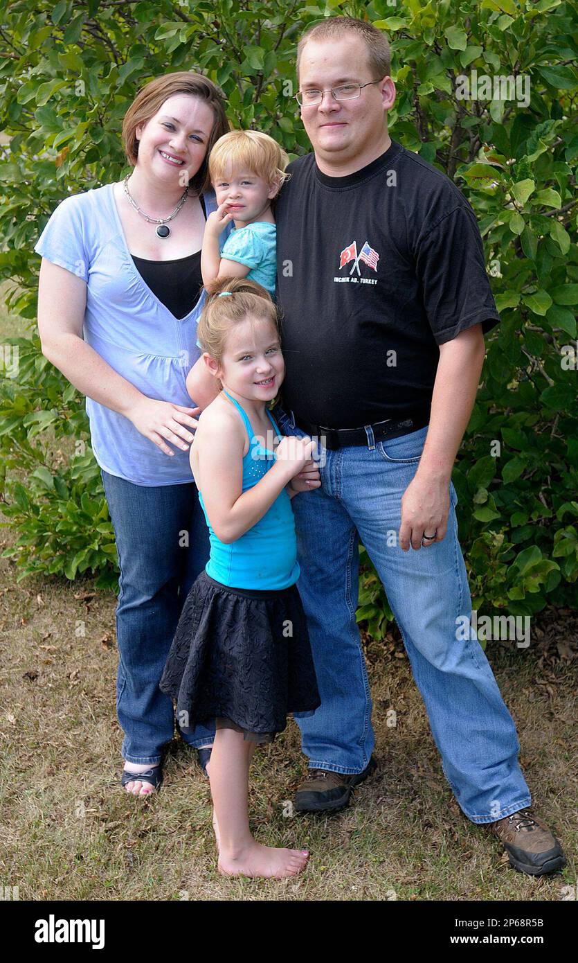 In a Friday July 6, 2012 photo, the Carlile family, Wes, Andrea and