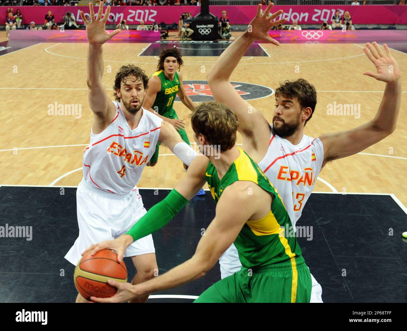 Brazil's center Tiago Splitter, center, vies with Spain's forward Pau  Gasol, left, and center Marc Gasol during a men's basketball preliminary  round match at the 2012 Summer Olympics on Monday, Aug. 6,