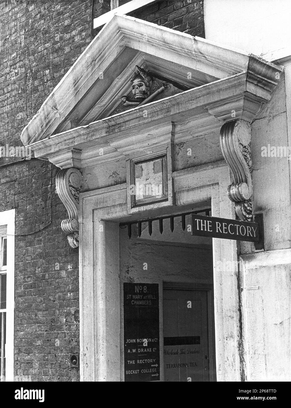 A skull & crossbones over the entrance to 8 St Mary at Hill Chambers, Billingsgate in the City of London, England UK - Photograph taken in 1970. Stock Photo