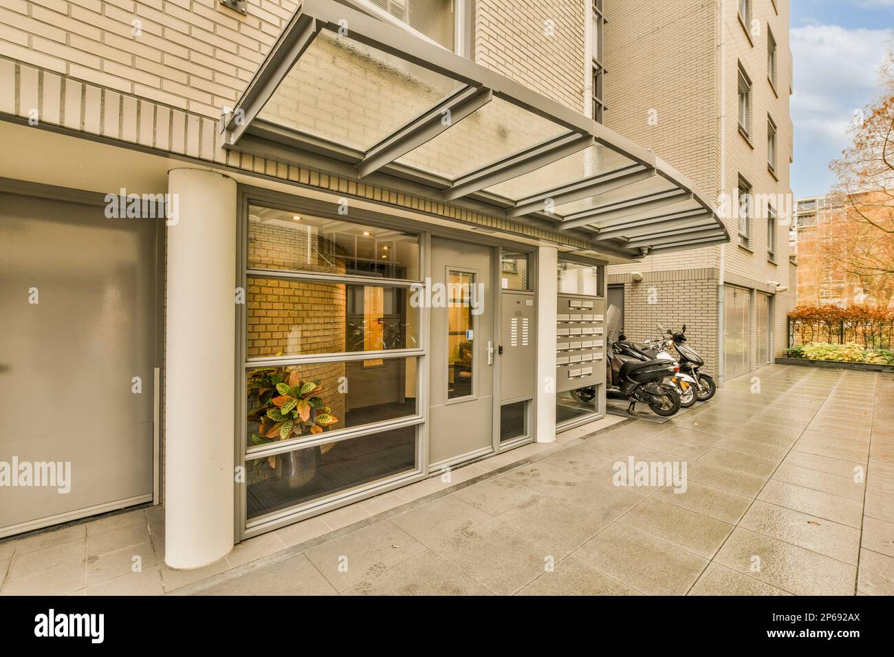 a motorcycle parked in front of a building on a sidewalk next to a