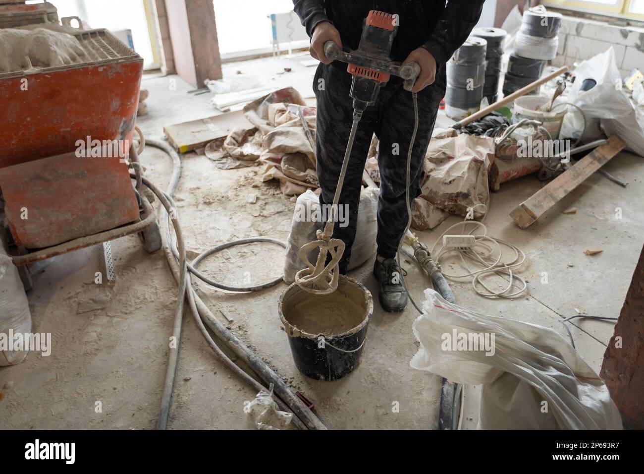 A specialized mixer for mixing dry plaster with water and automatically