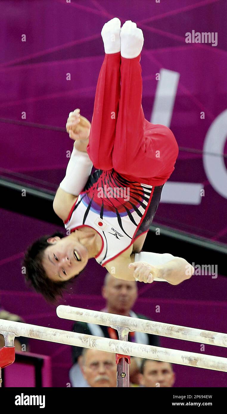 Kohei Uchimura of Japan performs on the parallel bars during the men's gymnastics all-around at the North Greenwich Arena on Aug. 1, 2012. Three-time world champion finally grabbed his first Olympic gold medal. 23-year-old Uchimura won wtih 92.690 points. ( The Yomiuri Shimbun via AP Images ) Stock Photo