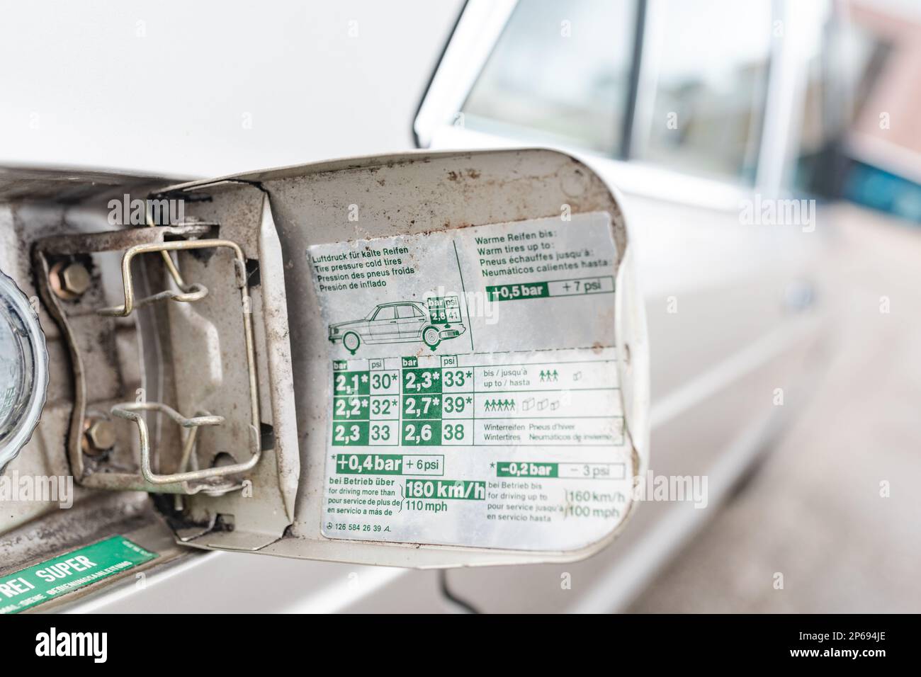 Open gas cap of a white car Stock Photo Alamy