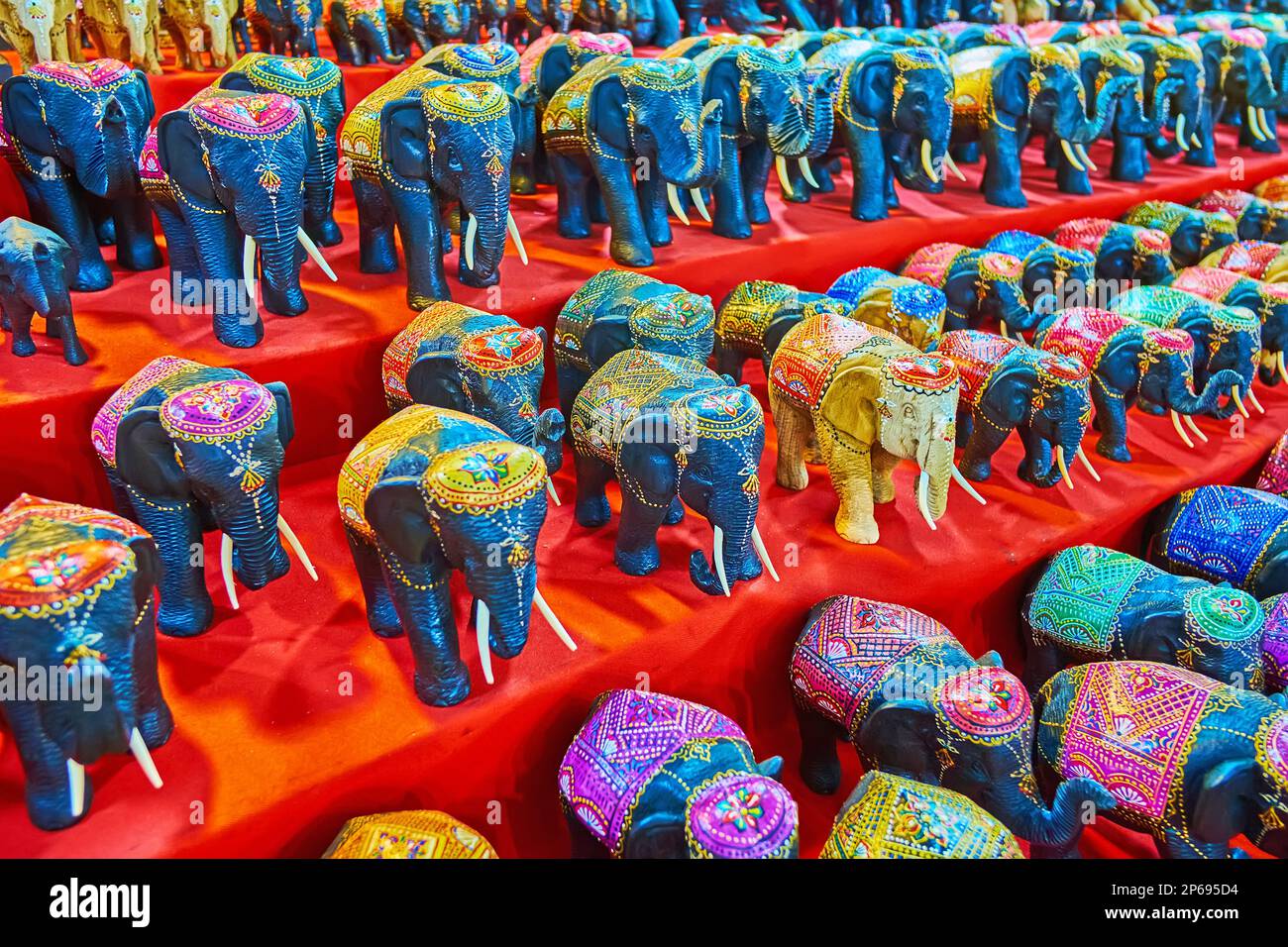 The counter of the Anusarn Night Market stall with handmade carved wooden elephants, decorated with fine patterns, Chiang Mai, Thailand Stock Photo