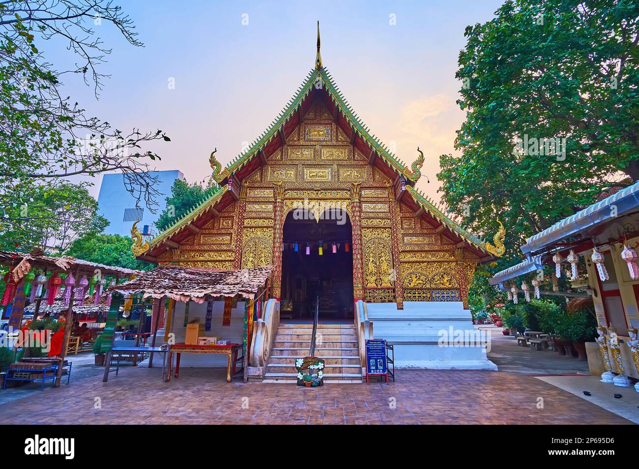 The carved gilt front gable-end of the medieval viharn of lanna style Wat Saenfang, Chiang Mai, Thailand Stock Photo