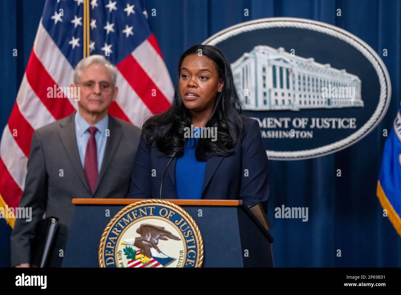 Principal Deputy Assistant Attorney General Doha Mekki speaks, accompanied by Attorney General Merrick Garland, left, during a news conference, Tuesday, March 7, 2023, in Washington. The Biden administration sued on Tuesday to block JetBlue Airways' $3.8 billion purchase of Spirit Airlines, saying the deal would reduce competition and drive up air fares for consumers. (AP Photo/Alex Brandon) Stock Photo