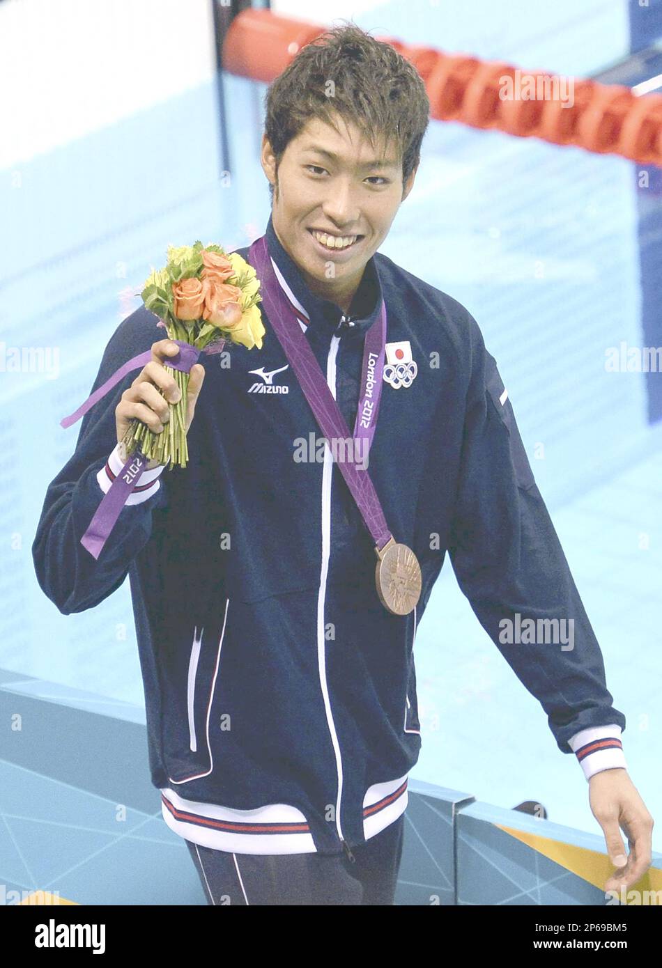 Kosuke Hagino Of Japan Strolls A Pool Deck After Receiving A Bronze kosuke-hagino-of-japan-strolls-a-pool-deck-after-receiving-a-bronze