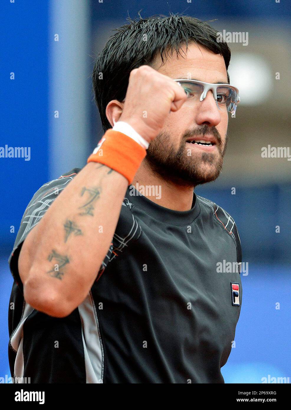Janko Tipsarevic of Serbia celebrate his victory against Paul-Henri Mathieu  of France after the semifinal match at the Suisse Open tennis tournament in  Gstaad, Switzerland, Saturday, July 21, 2012. (AP Photo/Keystone, Peter, image size:987x1390