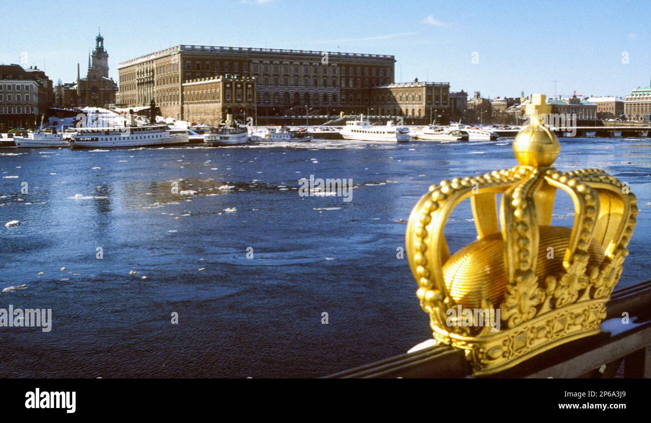 Royal Palace Stockholm  with a gilded crown in the foreground Stock Photo