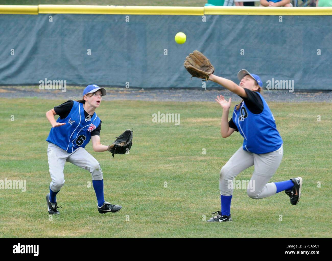 Minersville's Emily Kriston (6) and Kate Kramer (10) go for a ball in