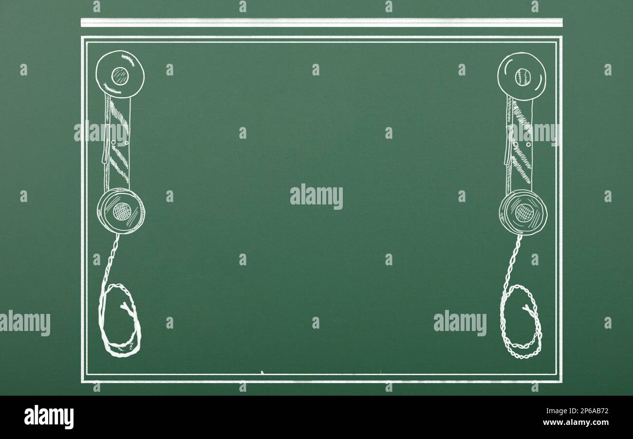 Two old telephone handsets with cable in a square frame. Space available in center for text. Logo design. Chalk drawing on schoolboard background Stock Photo