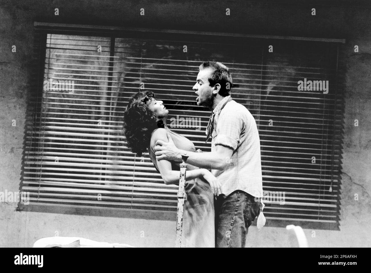 Julie Walters (May), Ian Charleson (Eddie) in FOOL FOR LOVE  by Sam Shepard at the Cottesloe Theatre, National Theatre (NT), London SE1  04/10/1984 design: Alison Chitty  lighting: Stephen Wentworth  director: Peter Gill Stock Photo