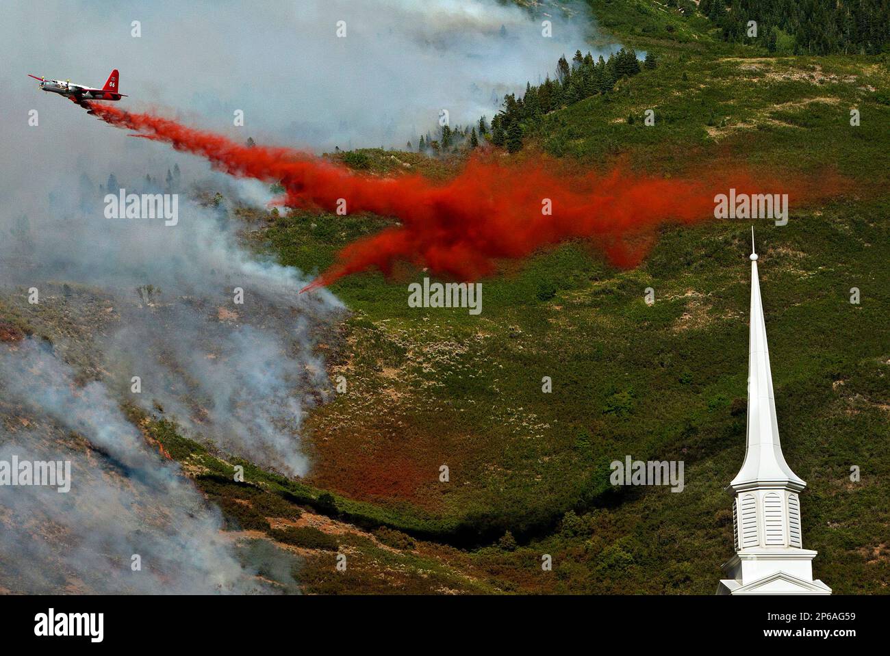 FILE In this July 3, 2012 photo, an aircraft makes a drop on the